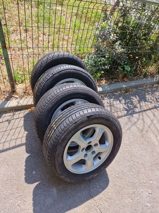 Jante aliaj originale Honda 15" plus anvelope vară Bridgestone Turanza T005 195/65 R15 91H