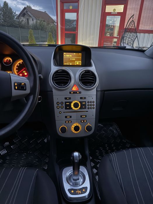 OPEL CORSA D AUTOMATA 1.2 BENZINA 80 CAI EURO 4,climatronic,comenzi volan+Mp3,anvelope noi M+S,recent adusa din Germania,km reali,absolut impecabila