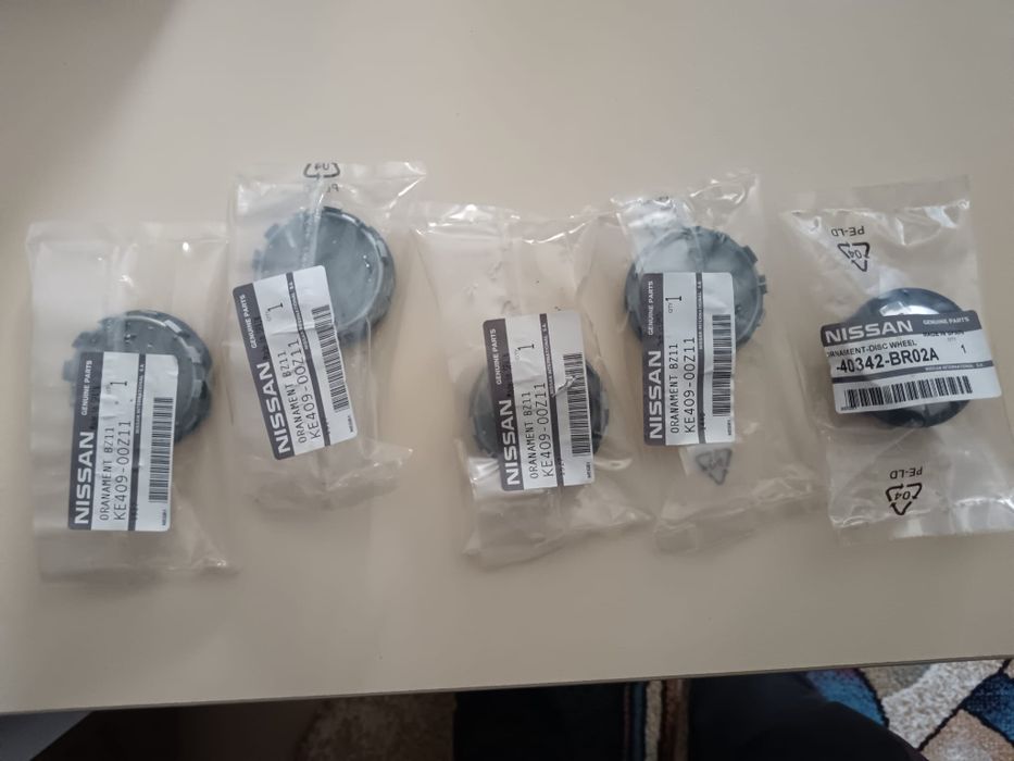 Vand set capace jante aliaj originale Nissan diametru 57 mm noi și originale după cum se poate observ