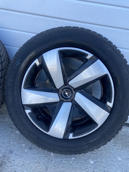 Jante tabla Opel Crossland  4x108 cu capace originale anvelope 205 / 60 / 16 M+S in stare foarte buna