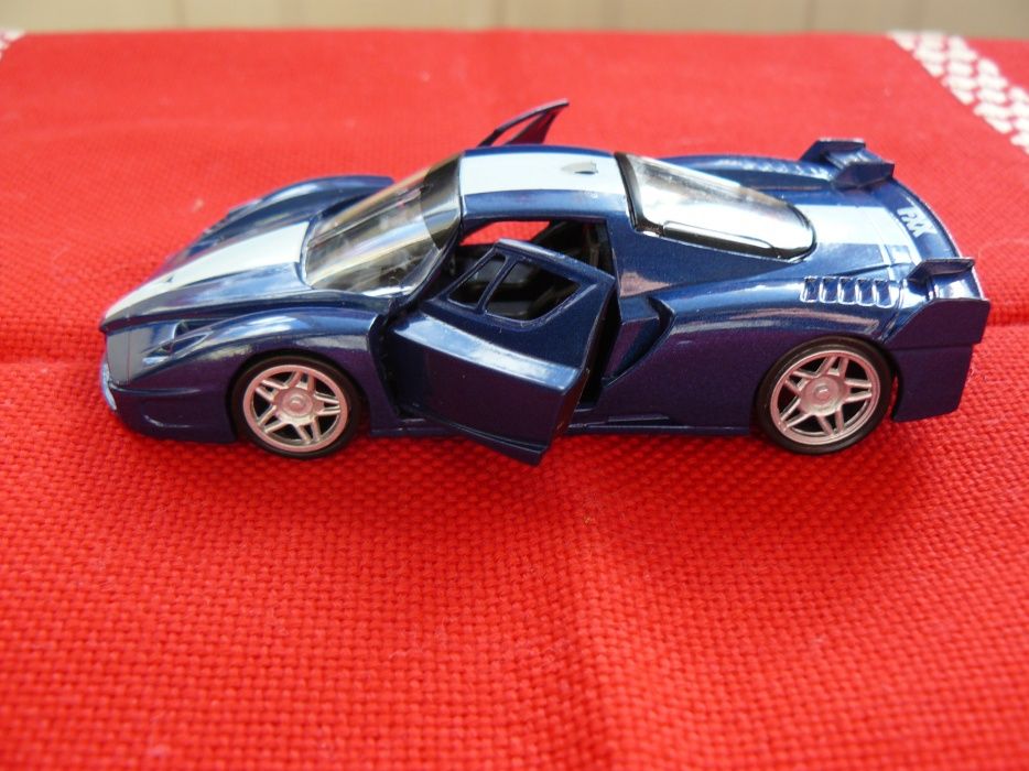 Macheta Auto FERRARI FXX Noua,Metalica,Scara 1:43,Produs De AmerCom