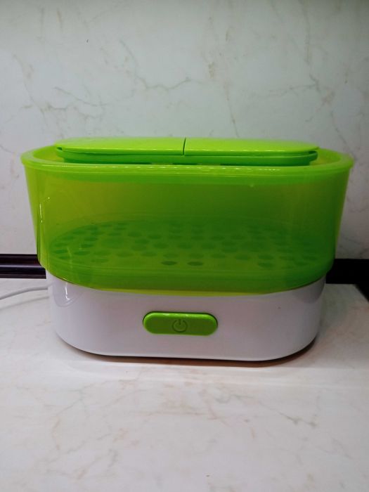 Стерилизатор за бебешки шишета и приготвяне на храна на пара