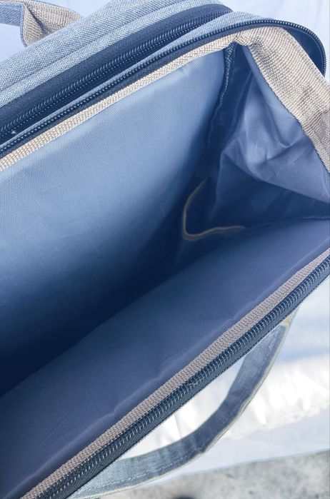 Раница с място за повиване на бебе