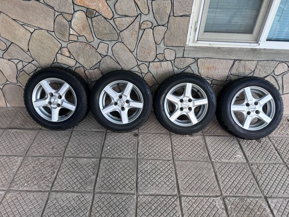 зимен комплект гуми  185/60/14 /6jx14h2. Без кривини по джантите.
