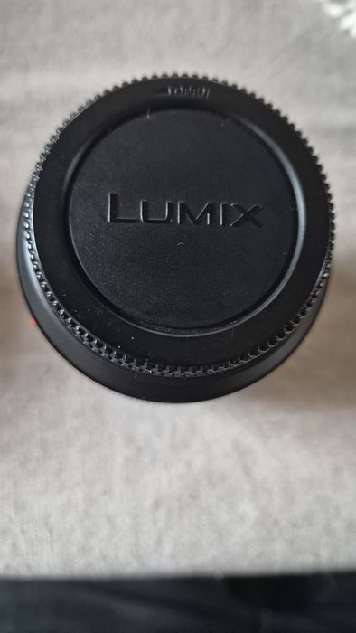 Vând  obiectiv Panasonic 12-60