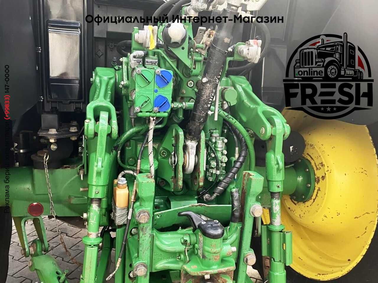 Колесный трактор John Deere 6115M
