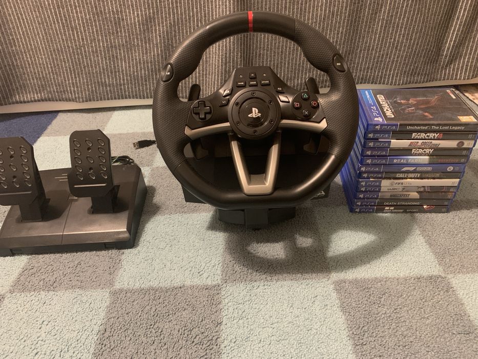 Volan PlayStation, pedale, și 12 jocuri