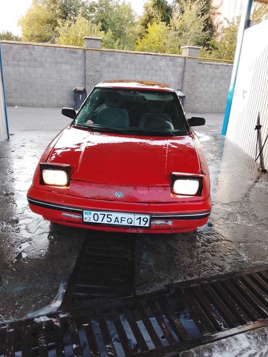 Легковой  авто Мазда 323