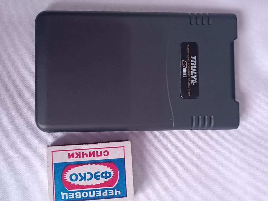 Новый калькулятор с выдвижной крышкой