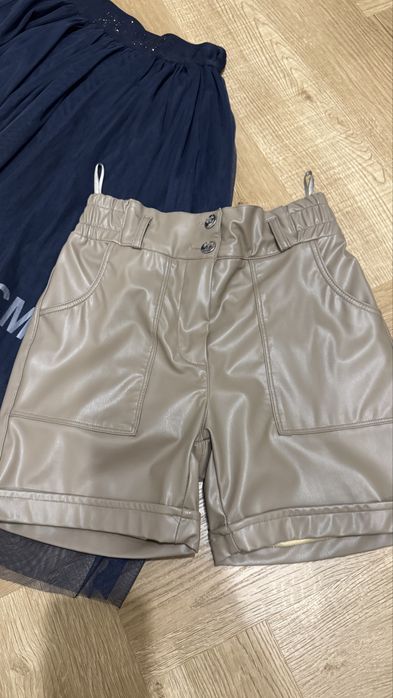 Шорты из эко кожи, юбка 140 р