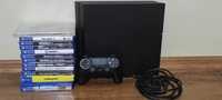 PlayStation 4 cu un controler si jocuri