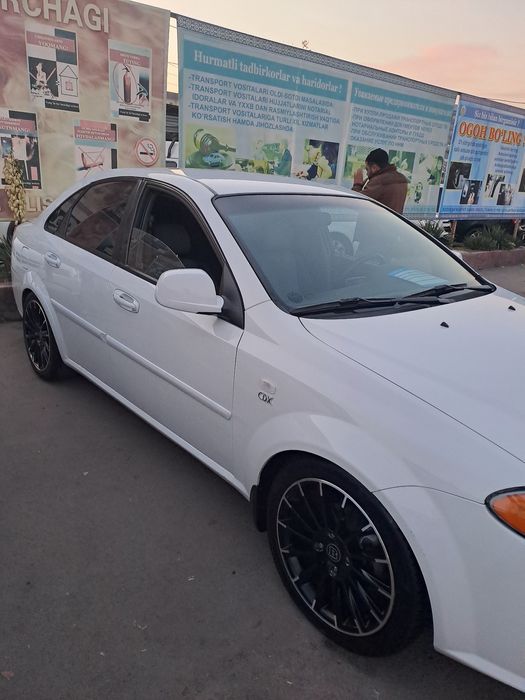 Ласетти 2011 автомат жентра килинган