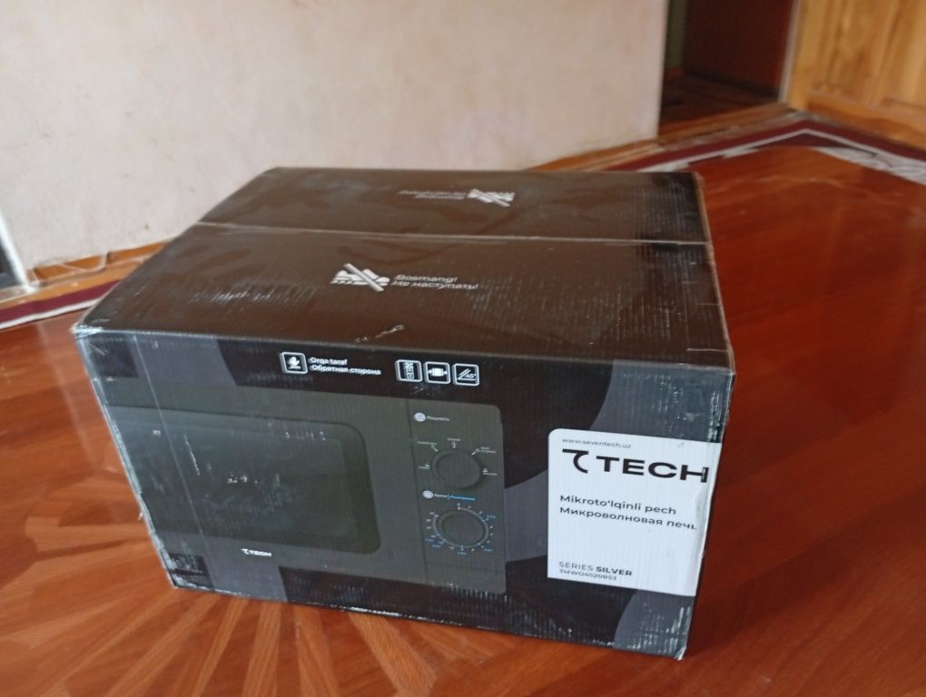 Seven tech mikrovolnovka . Yangi turibdi ochilmagan kelishladi kamibor