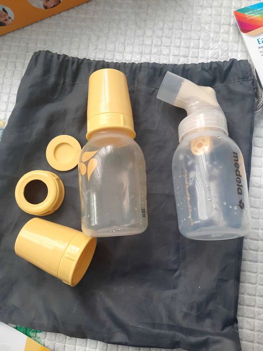 Ел. помпа за кърма Medela + торбички за кърма + резервни клапи