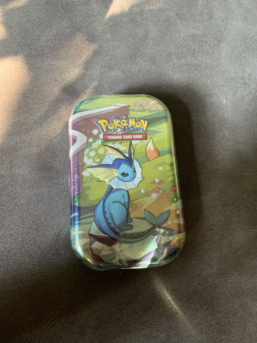 Pokemon Prismatic Evolutions Tin Vaporeon