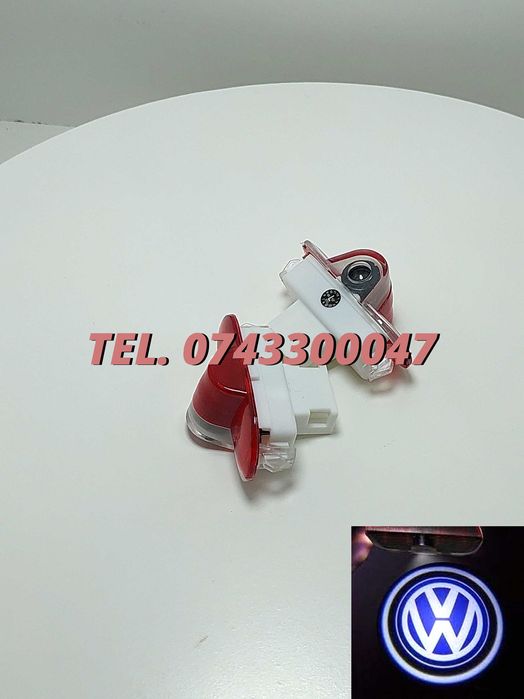 Proiectoare Logo Portiere Vw Golf 4 Caddy Touran Bora Passat