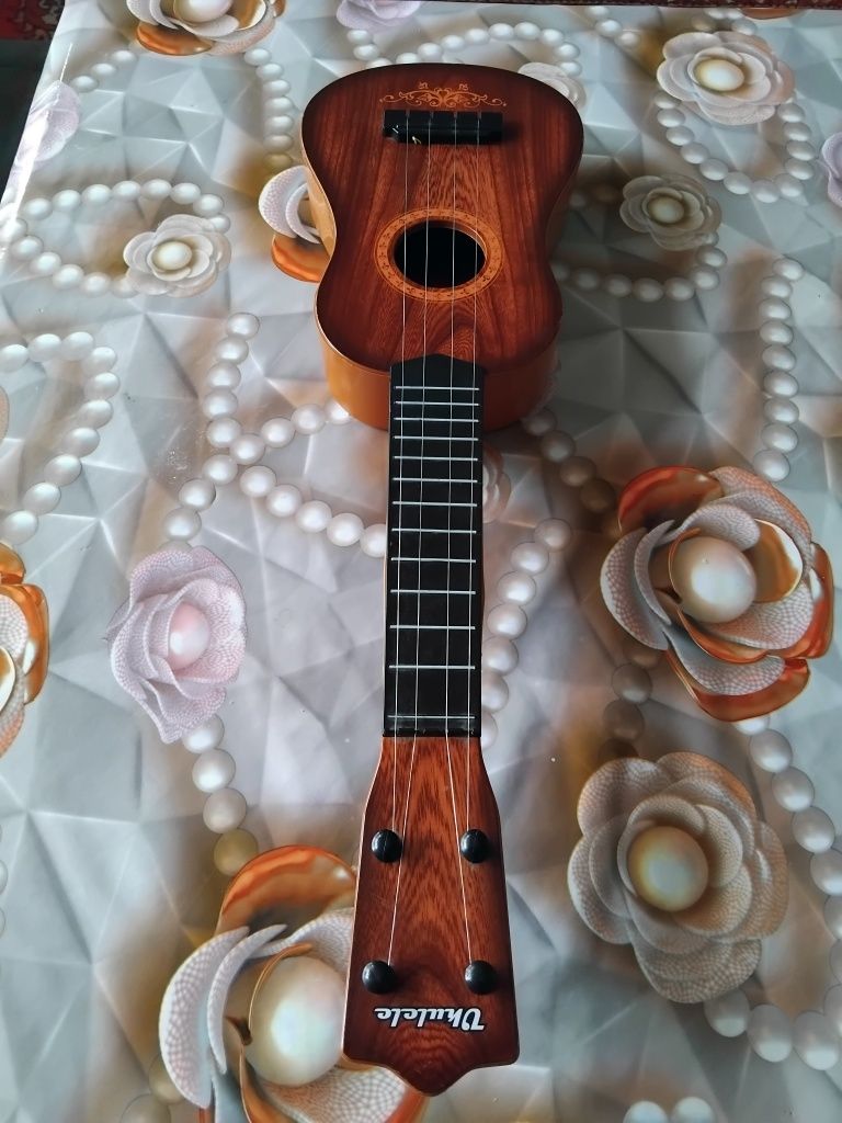 Mini Gitara chalgʻu asbob sirochna sotiladi