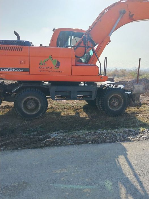 Доосан колёсный эксковатор 210 инжектор матор сотилади холати яхши