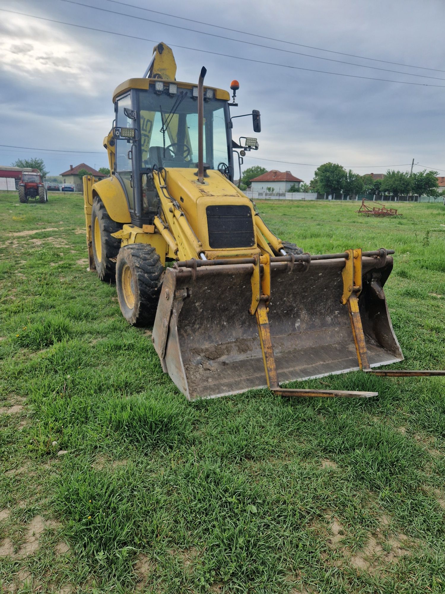 Buldoexcavator New Holland NH95