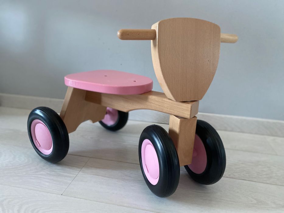 Детско дървено колело за бутане в розово от New classic toys