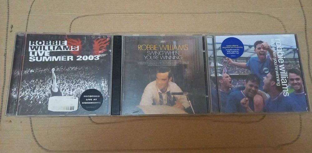 CD на Robbie Williams.