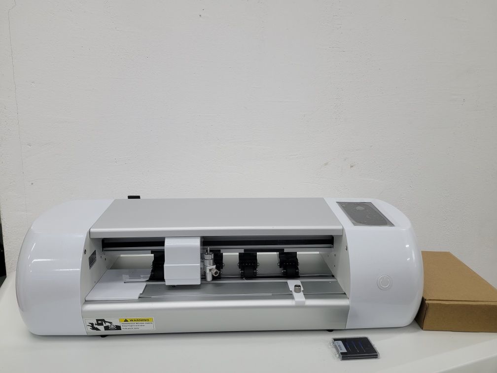 Plotter. Screen protector film cutter with built-in database