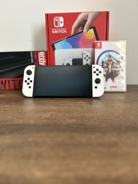 Vand nintendo switch oled cu joc mortal kombat 1