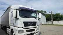 Man Tgx EEV plus semiremorca Schmitz