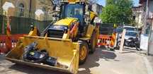Inchirierz - Buldoexcavator cu picon CAT 428  - București ( centru ) -