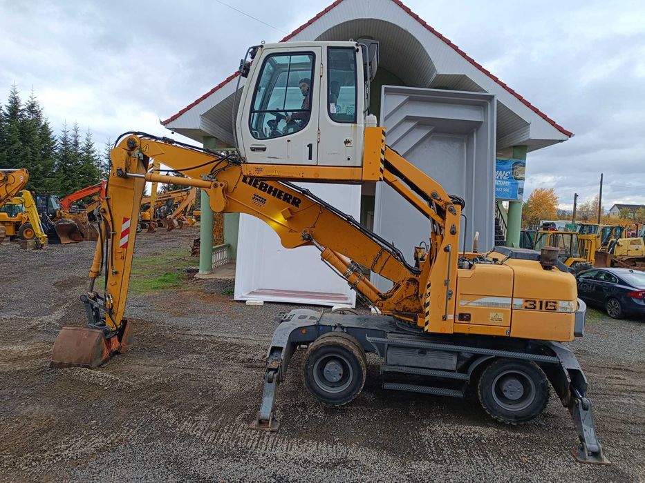 Excavator pe roti Liebherr A316, 21 tone, pentru manipulare, 2009