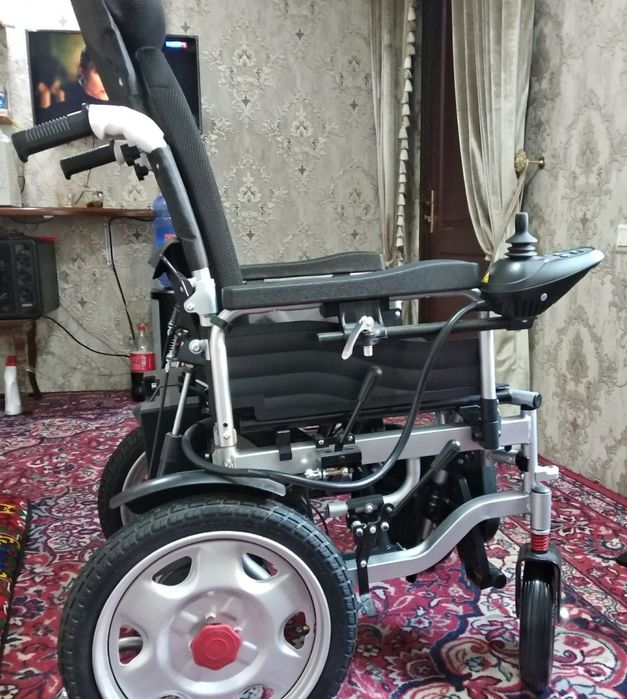 Инвалидная коляска.