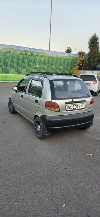 Матиз с метан газом и с кондиционером.