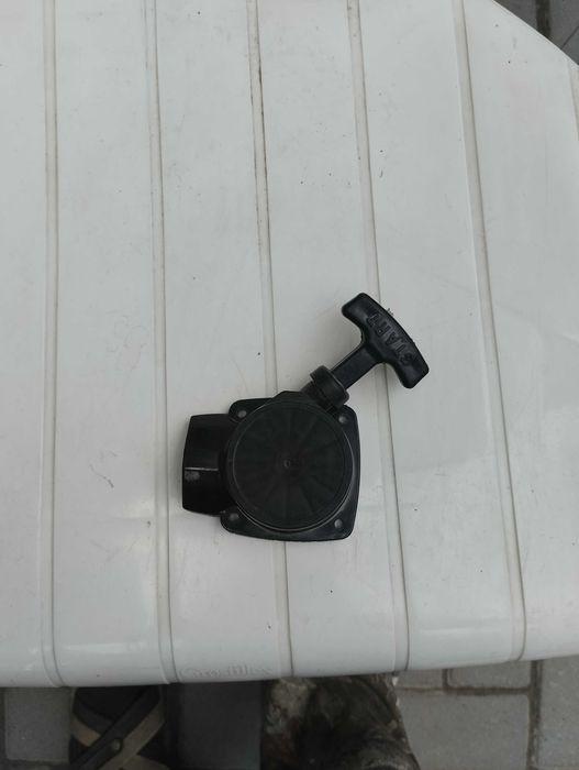 Ручной стартер для бензотриммера.