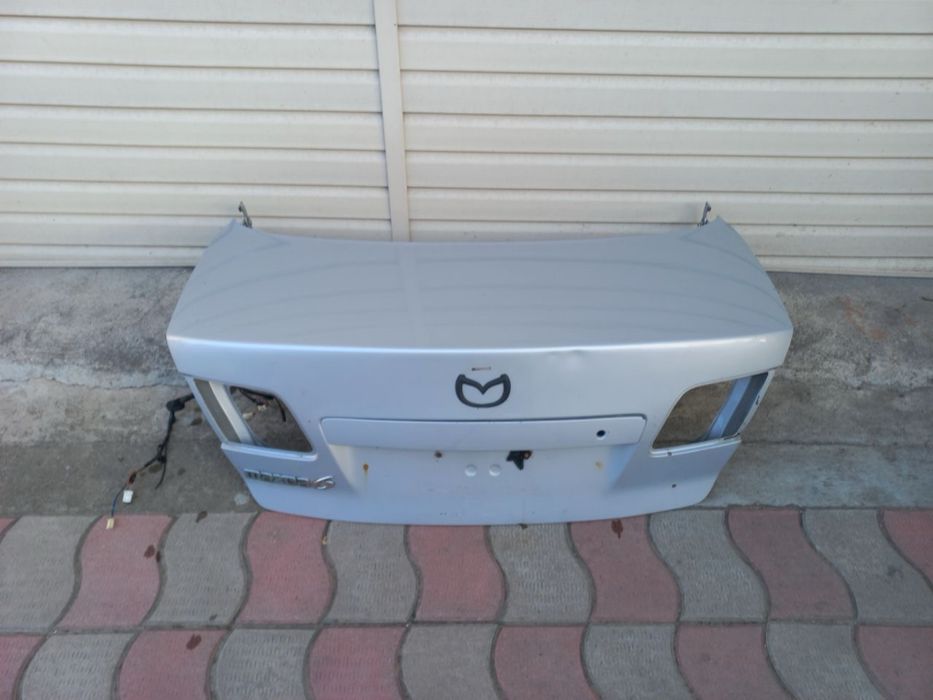 Крышка багажника, Крыло левый Mazda GG