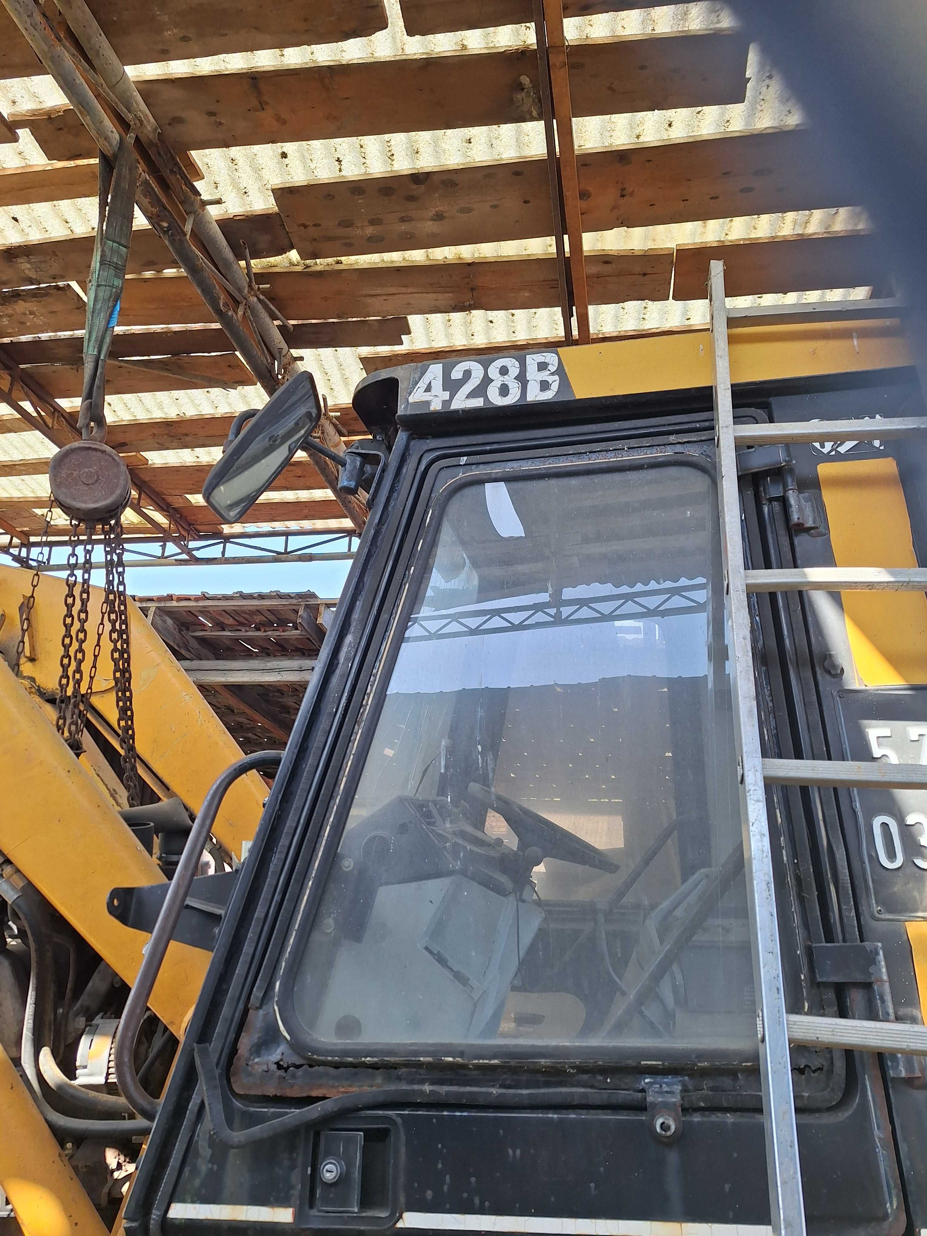 Buldoexcavator  caterpillar
