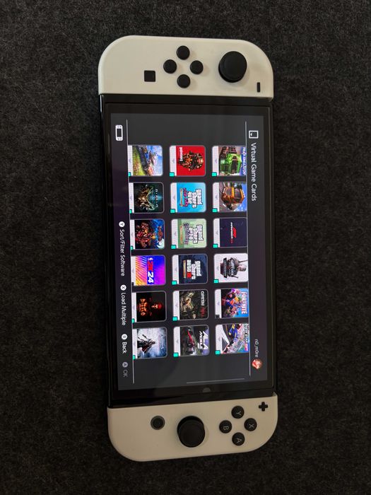 Nintendo Switch OLED - White + 30 дигитални игри и подарък волан