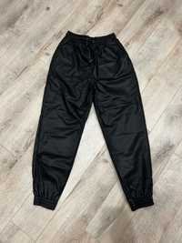 Black faux leather trousers