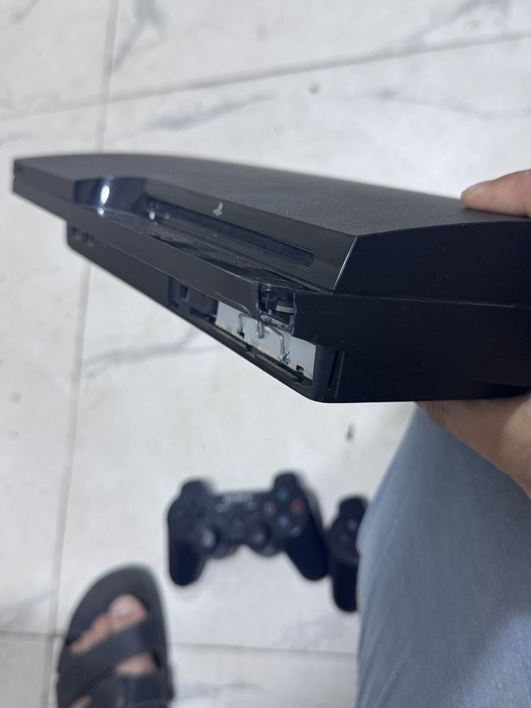 Playstation 3 slim xolat 2 rasimda ishlashiga gap yo oyinla yozilgan
