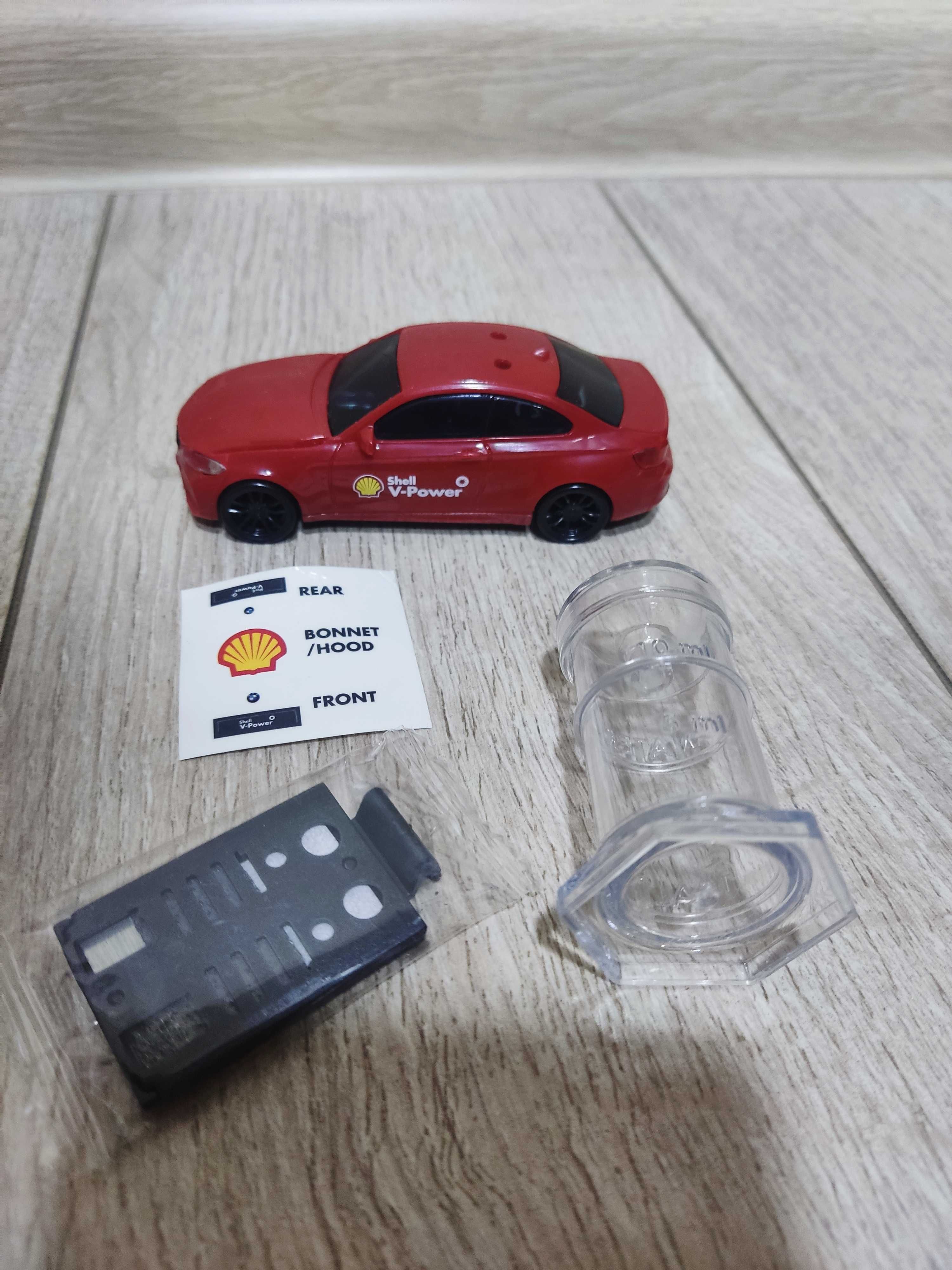 Машинка BMW на солевой батарейке из коллекции Shell, из пластмассы.