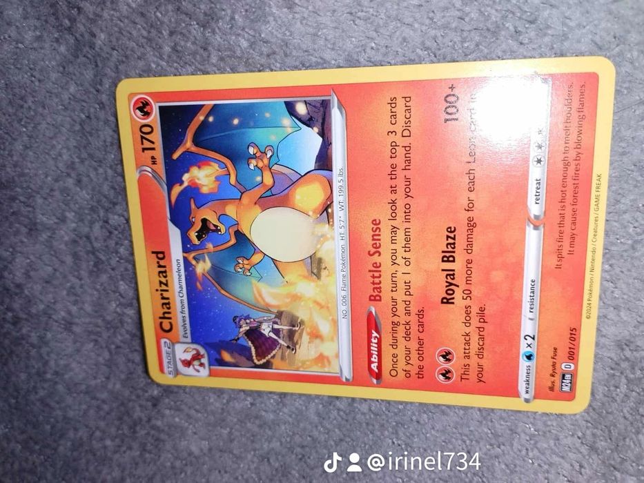 Pokemon cards, 1 Charizard, 1 Roaring Moon pret 100 Ron negociabil