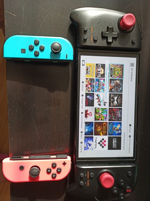 Vând nintendo switch oled card 512gb MODAT full cu jocuri