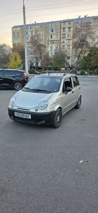 Матиз с метан газом и с кондиционером.