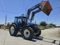 New Holland TM 140  cu incarcator