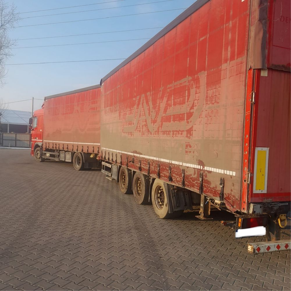 Camioane DAF XF tandem remorci Schmitz