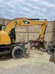 Колесный экскаватор CAT M318D