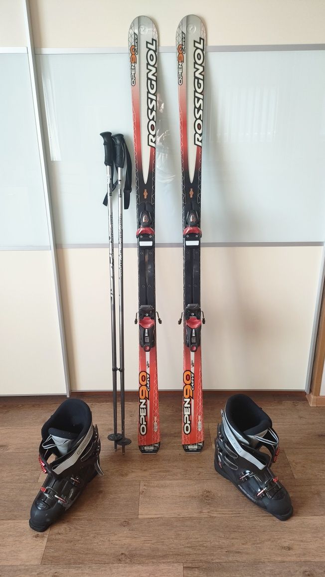 Горные лыжи с креплениями, палки, ботинки Rossignol .
