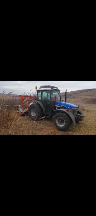 Tractor New Holland volan reversibil, freza forestiera tocător