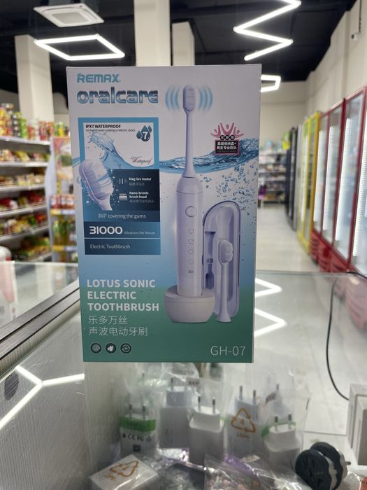 Электрическая зубная щетка