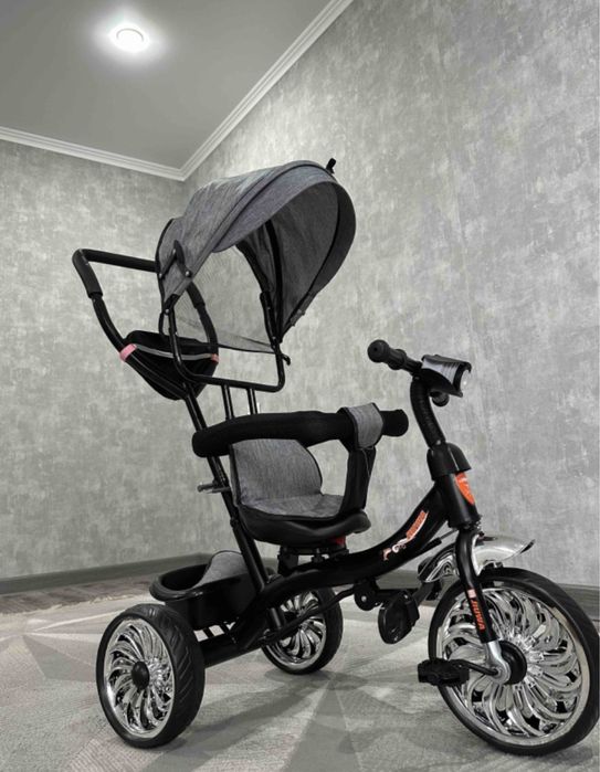 Жаңа трехколесный велосипед