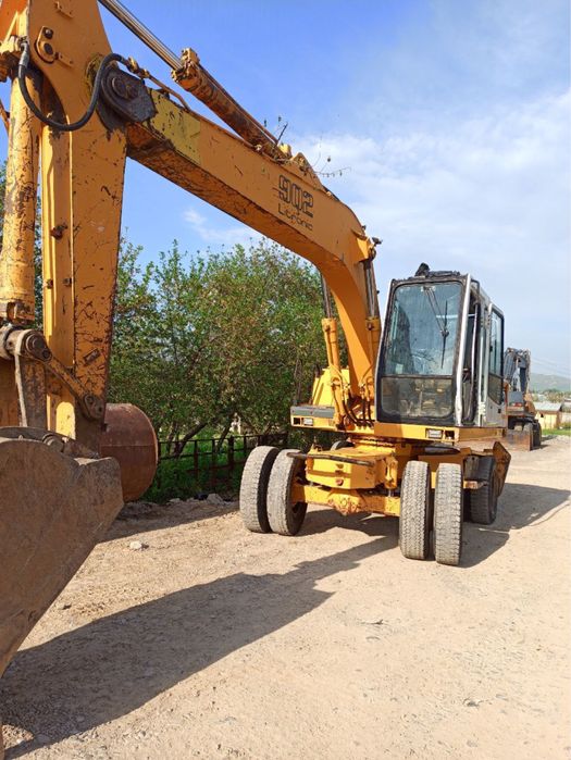 Lipher 902 ekskavator sariq